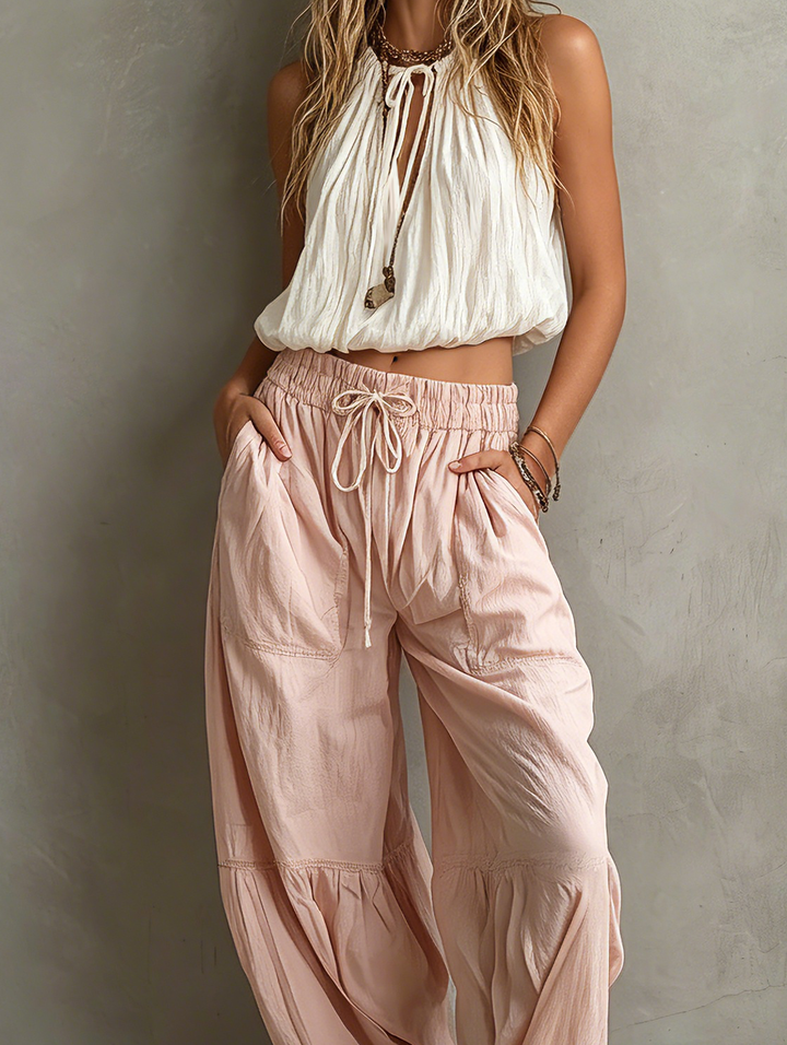Top sin mangas redondo para mujer, color blanco tejido informal, combinado con pantalones rosas tejidos MDZ1268F0LXY