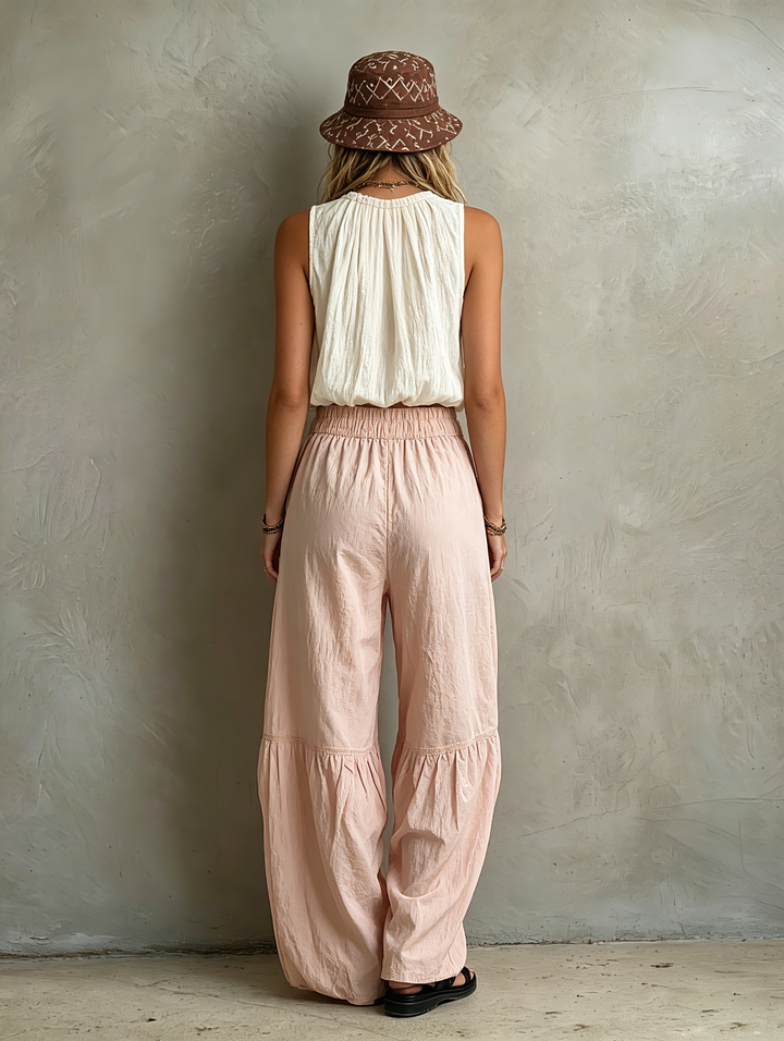 Top sin mangas redondo para mujer, color blanco tejido informal, combinado con pantalones rosas tejidos MDZ1268F0LXY